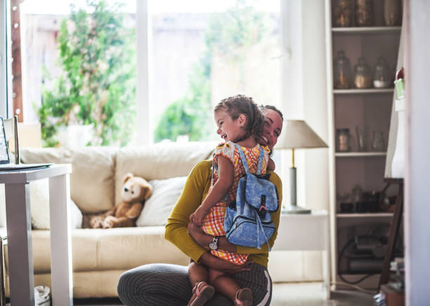 loving mom sends adorable daughter off to school - first day of school imagens e fotografias de stock