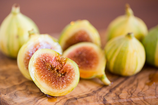 Tiger Stripe Figs\n\n‘Panache Tiger Fig’ is a paragon of beauty and taste. Fig tree’s delicious small-to-medium-sized green fruits are beautifully patterned with yellow tiger stripes. Scrumptious fruits, with aromatic, highly flavorful blood-red flesh, make for fine fresh eating; add nectary sweetness to salads and cereals; and, partnered with fresh quince, is the stuff of which superb jams and pies are made.