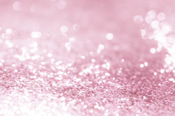 istock Rose gold glitter confetti defocused background texture. 1046123142