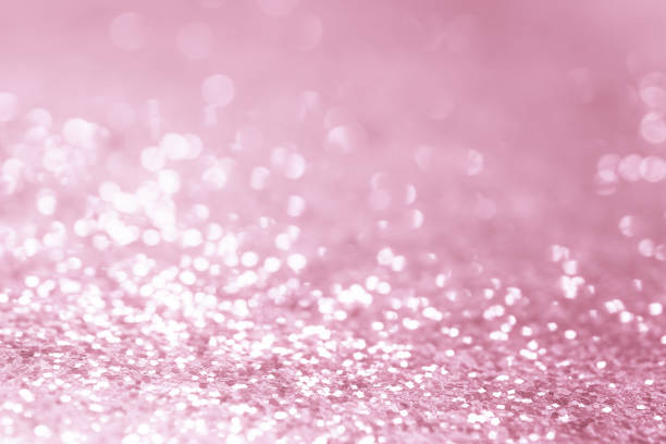 istock Rose gold glitter confetti defocused background texture. 1046123342