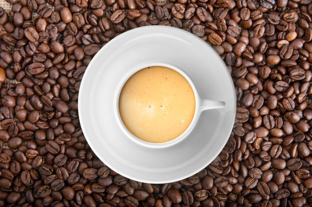 istock 3d rendering cup of coffee on coffee beans 1046124740