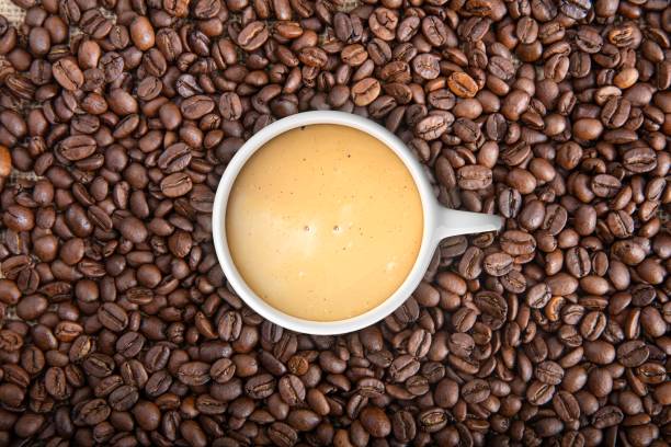 istock 3d rendering cup of coffee on coffee beans 1046124764