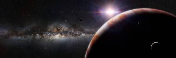 istock planet Jupiter lit by the rising Sun, with galaxy background 1046130322