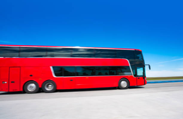 coach bus on the highway - bus coach bus travel red imagens e fotografias de stock