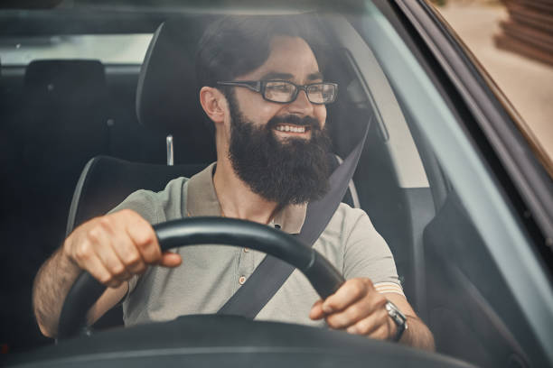 istock A modern bearded man driving a car 1046145350