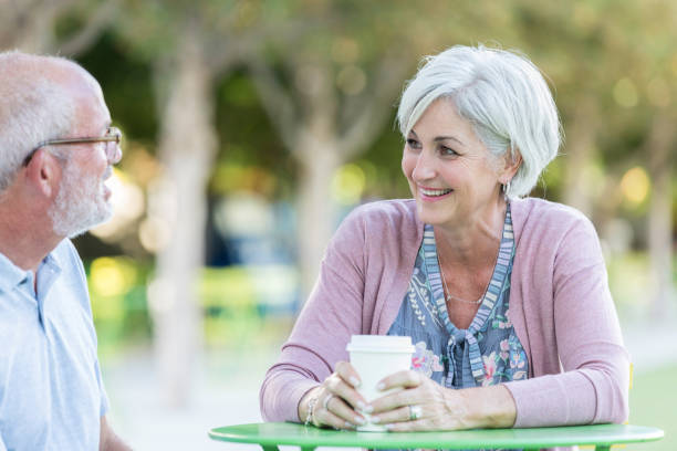 istock Couple enjoy coffee outdoors 1046150444