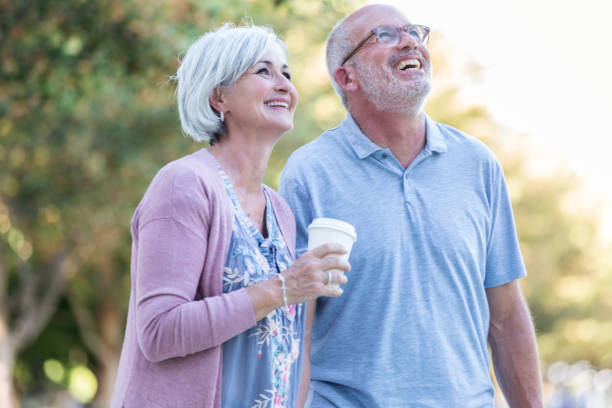 istock Couple stroll in city park 1046150446