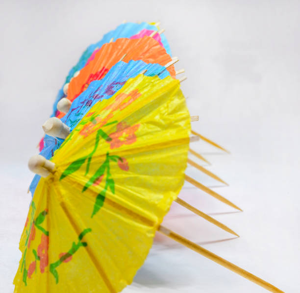 istock umbrellas for cocktails. paper parasols 1046152696