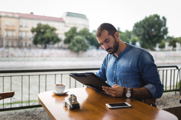 istock Handsome businessman in cafe 1046152838