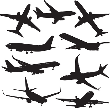 Vector silhouettes of nine commercial airplanes.