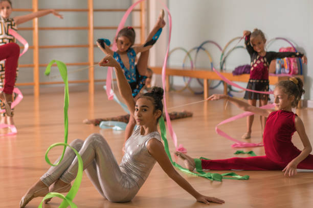 istock Young ballerinas dancing doing practice in ballet studio. 1046156660