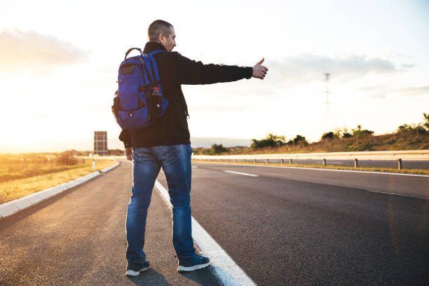 istock Hitchhiker try to stop transport 1046158882