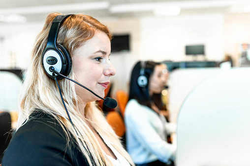 Young caucasian women working at a call center.