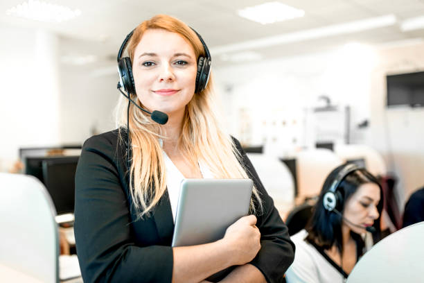 women working at a call center - women customer service representative service standing imagens e fotografias de stock