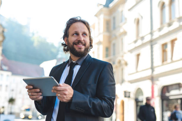 istock Businessman using digital tablet in the city 1046168168