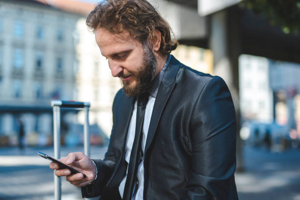 istock Businessman using smart phone in the city 1046168224
