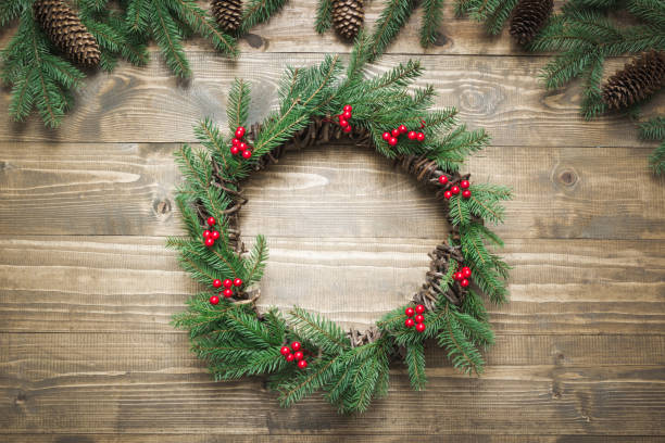 istock Woman making Christmas wreath using fresh and all natural materials. Flat lay. Top view. 1046168874