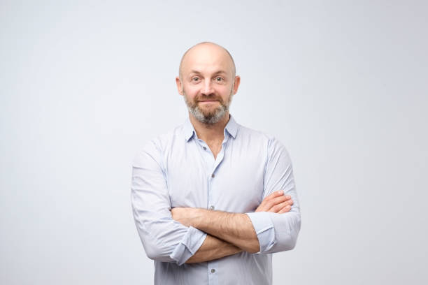 istock Confident smiling man with crossed arms. Happy content mala with bristle looking at camera. 1046172586