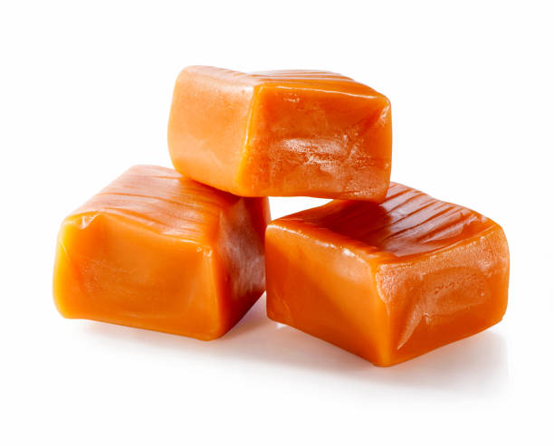 istock toffee caramel candies close-up isolated on white background 1046175020