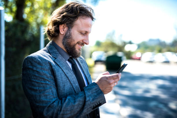 istock Businessman using smart phone in the city 1046177990