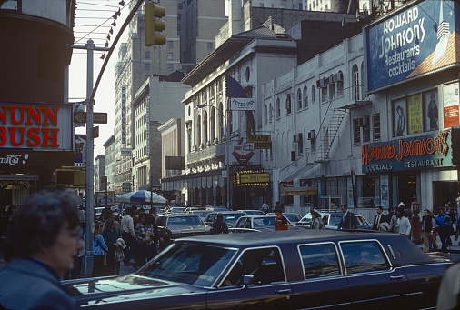 Manhattan, NYC, NY, 1980. Broadway Street Scene in Downtown Manhattan. Furthermore: pedestrians, shops, advertising, buildings, advertisements, cars and traffic.