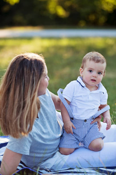 istock Mother and Twin Boys at the Park 1046184824