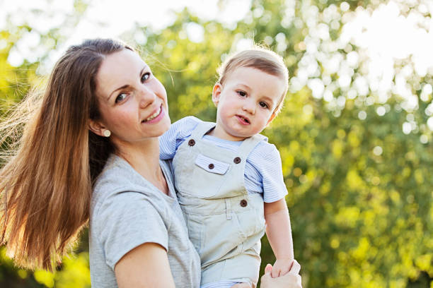 istock Mother and Twin Boys at the Park 1046184826