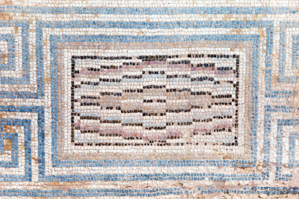 istock Ancient, antique mosaic of small colored tiles with geometric pattern. 1046190306