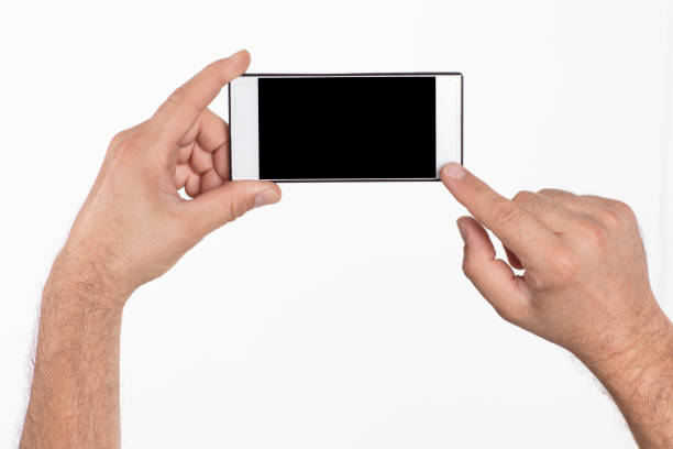 istock Hand holding mobile phone on white background. 1046192760