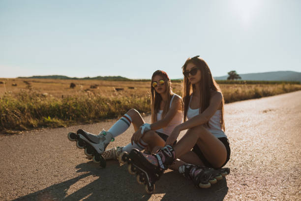 istock Best friends driving inline skates on a sunny summer day 1046202172