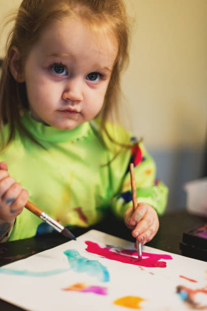 istock Girl Painting 1046202482