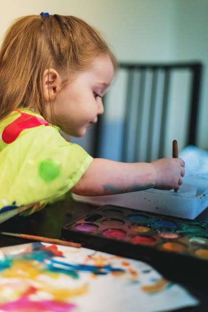 istock Girl Painting 1046202484