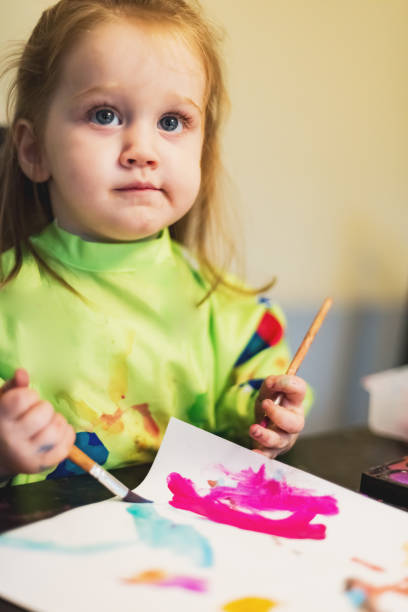 istock Girl Painting 1046202490