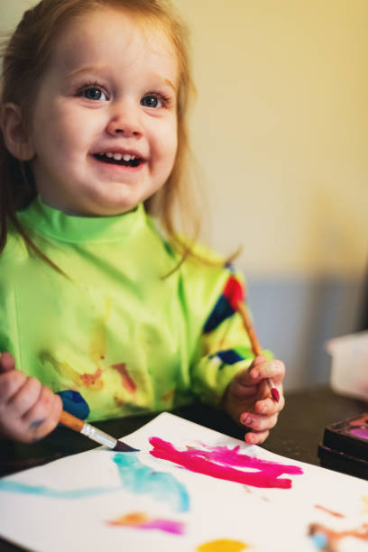 istock Girl Painting 1046202494