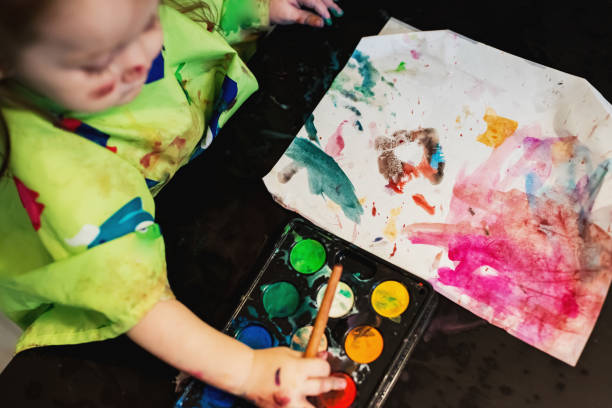 istock Girl Painting 1046202568