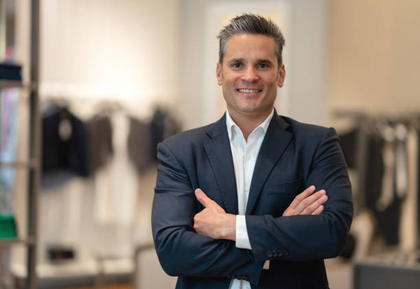 istock Happy man shopping for clothes at a store 1046208146