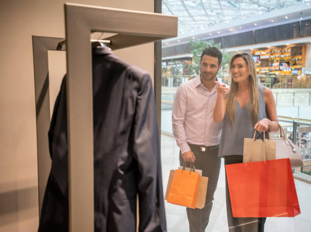 istock Happy couple shopping at the mall 1046208286