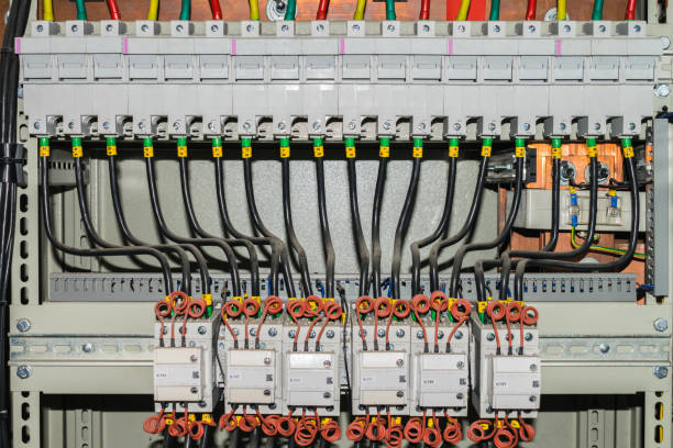 istock Electrical panel comprising a plurality of switches and wires 1046209222