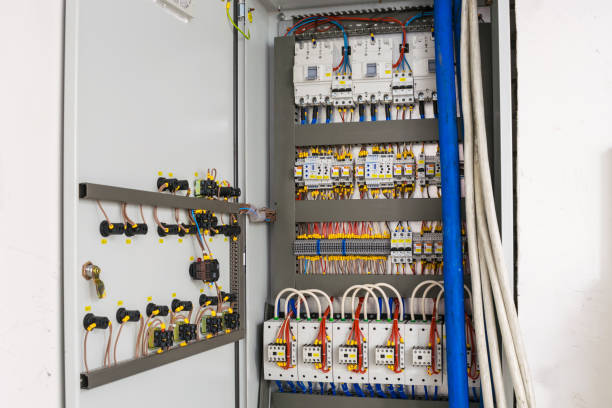 istock An electrical box containing many contacts, relays, switches and wires. Technical cabinet with high-voltage equipment and powerful power cables. Switchboard at the factory. 1046211650