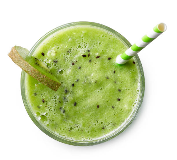 Glass of kiwi smoothie Glass of green kiwi smoothie with straw isolated on white background. Top view blended drink photos stock pictures, royalty-free photos & images