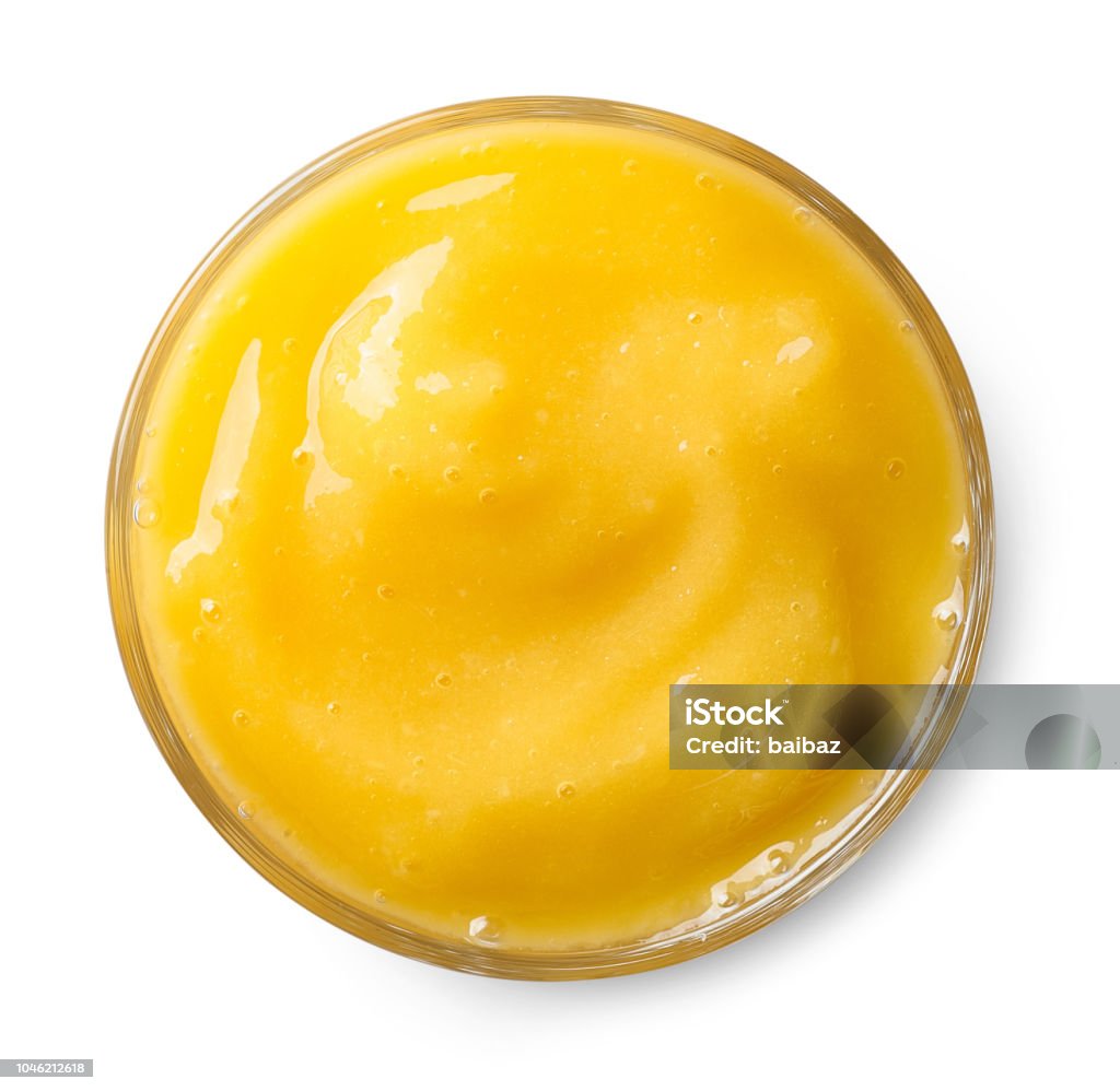 Glass of mango smoothie Glass of yellow mango smoothie isolated on white background. Top view Smoothie Stock Photo