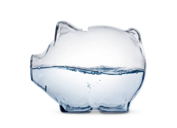 Water Saving Water in the piggy bank, isolated with clipping path. water conservation photos stock pictures, royalty-free photos & images