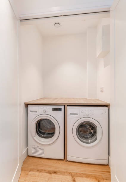 istock Small utility room with washing machines 1046226230