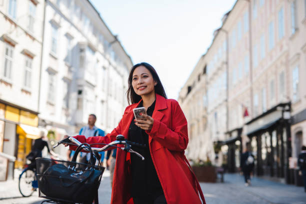 istock Businesswoman using smart phone in the city 1046232016