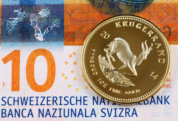 ten swiss franc note with a gold krugerrand one ounce coin - ten rand note imagens e fotografias de stock