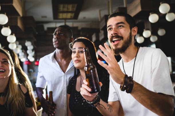 istock Friends watching a game in the pub 1046246034