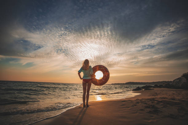 istock Young woman alone during sunset 1046246210