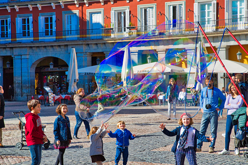 Madrid, Spain-16 September, 2017: Children and families playing and having fun at the central Madrid Plaza, Plaza Mayor