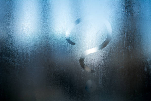 istock question mark on wet misted glass. 1046249310