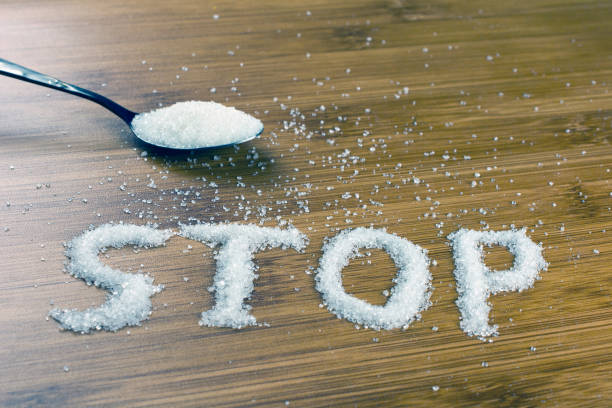 istock sugar inscription stop on the table, spoonful of sugar. 1046252202